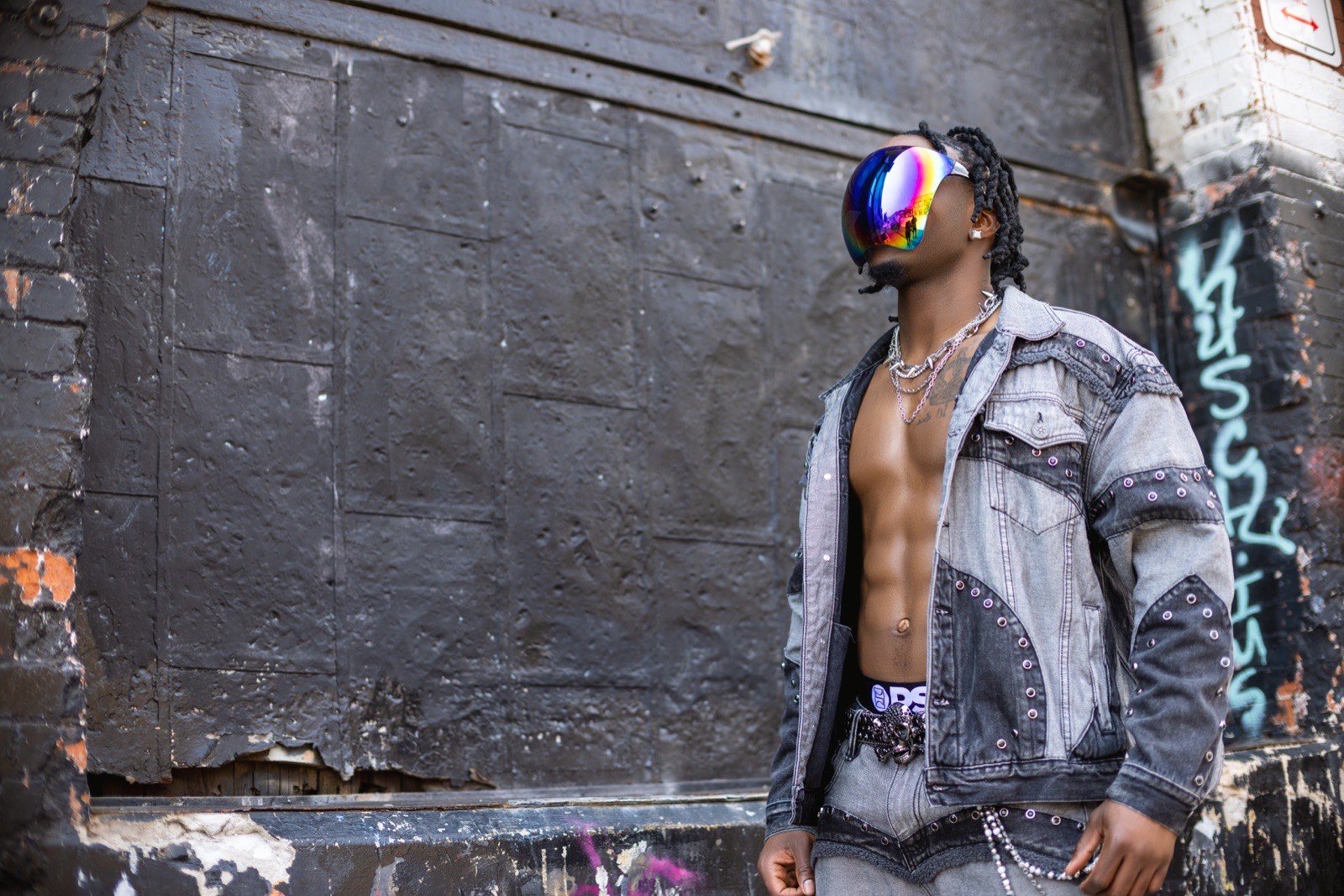 Dan G in denim against the steel wall