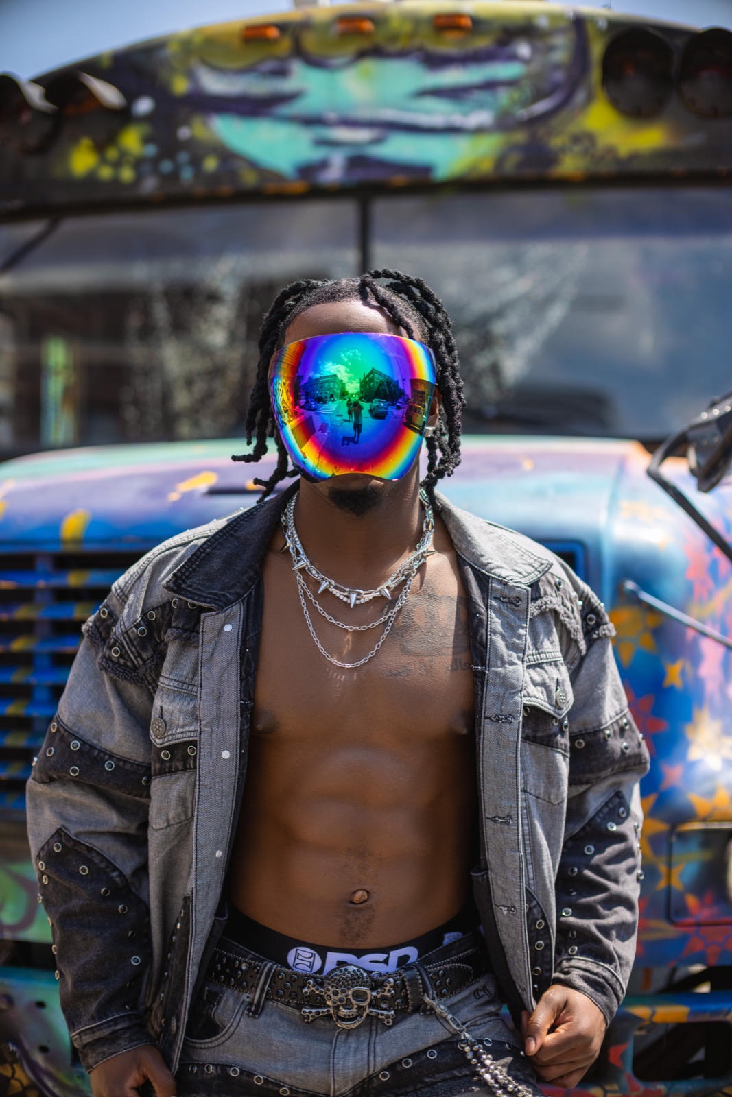 Dan G in chrome visor by the graffiti bus